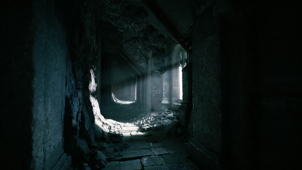 Abandoned corridor with light streaming through broken windows