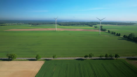 Journey-in-Europe,-Across-Flat-Land-with-Wind-Turbine-Farm,-Drone-View
