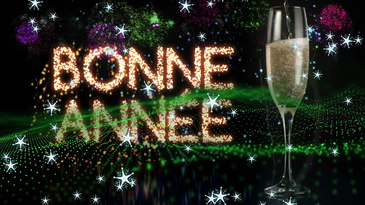 Fiocchi di neve che cadono sul testo "Buon Anno" e bicchiere di champagne con fuochi d'artificio che esplodono