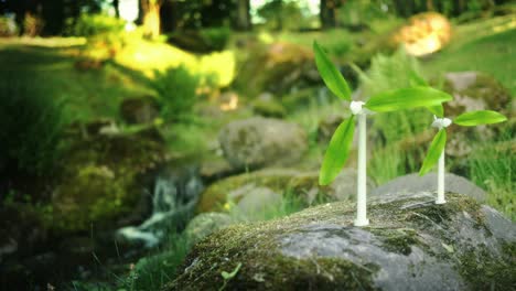 group of small windmills with green leaves as blades