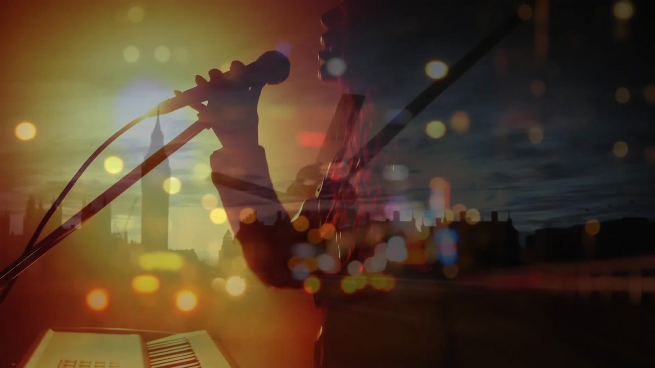 Caucasian female singer singing and playing keyboard during concert over city