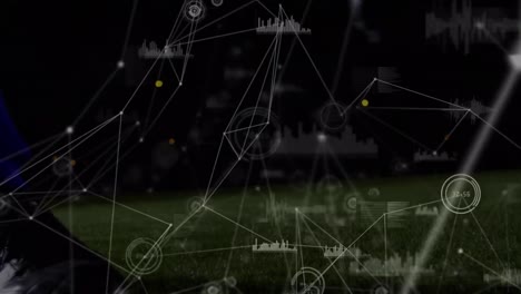 Animation-Eines-Netzwerks-Von-Verbindungen-über-Dem-Unteren-Teil-Eines-Männlichen-Fußballspielers,-Der-Den-Ball-Tritt