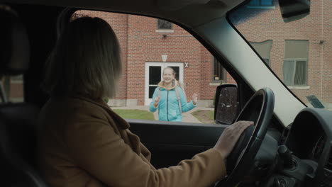 a parent picks up his child from school, the girl joyfully runs to her mother