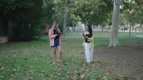 two friends reading in a park