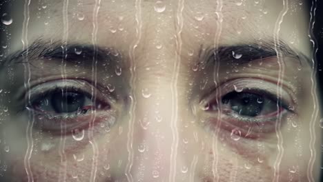 a person is gazing intently through rain-smeared glass, highlighting their emotions while droplets cascade down. the atmosphere feels contemplative amidst the dreary weather.