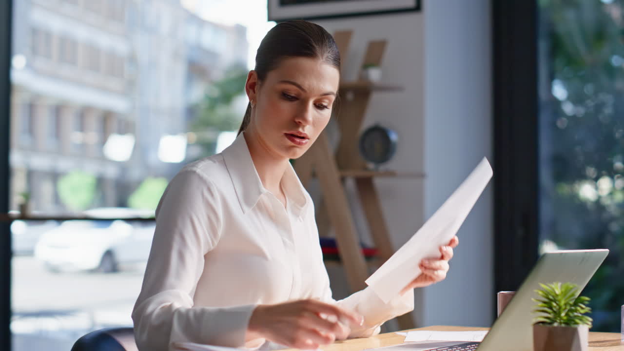 Corporate specialist focused paperwork sitting office closeup. Lady working