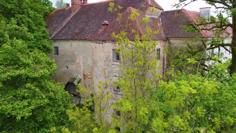 Aerial-travel-over-Schloss-Kalsdorf,-Austrian-castle-from-above-with-drone