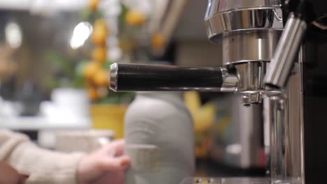 mounting the portafilter with coffee before making the coffee