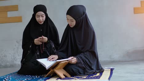 asian muslim woman praying and prostrating at home