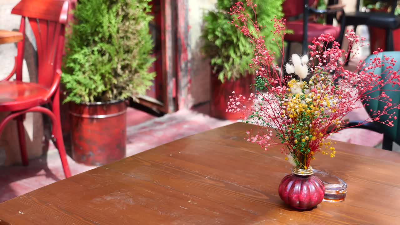 Outdoor Cafe Table with Flowers and Plants