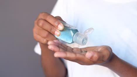 applying hand sanitizer