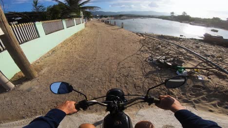 pov of young man riding motorcycle near very polluted roadside in vietnam