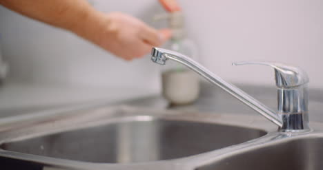 Man-Washing-Hands-In-Sink