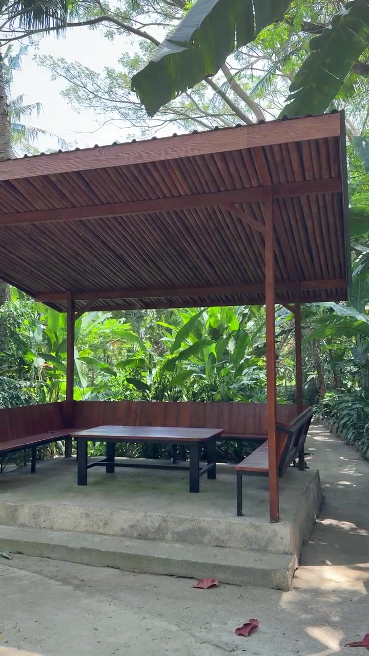 Wooden Gazebo in a Lush Tropical Garden
