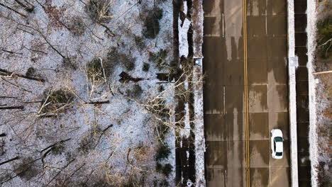 mount sequoyah with trees dusted in snow, urban edge visible, winter setting, aerial view