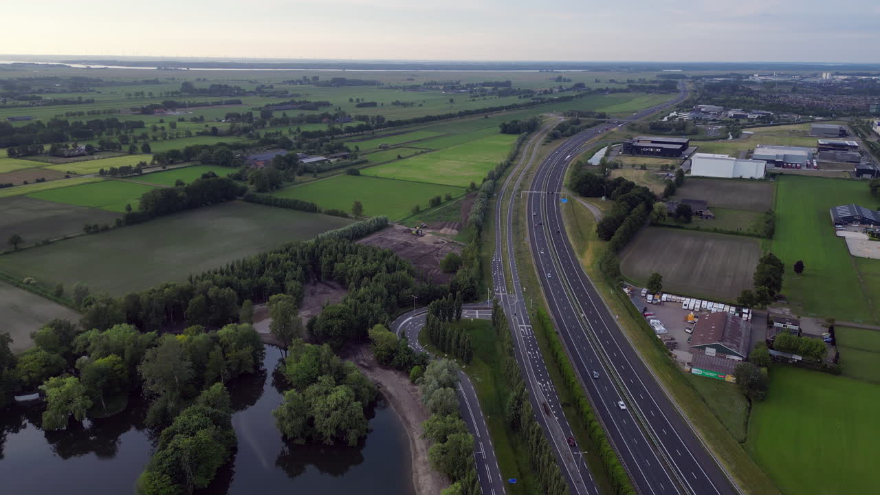 Railway and highway on Amersfoort - 4K Stockvideo
