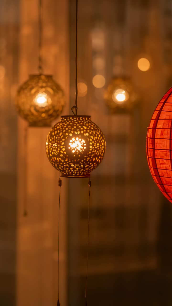 Vertical video: Glowing metal lantern swaying with slow camera move in shop display, red lantern