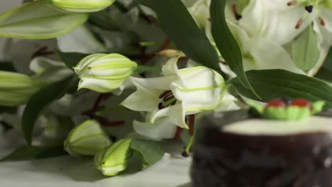 white lily bouquet and chocolate cake