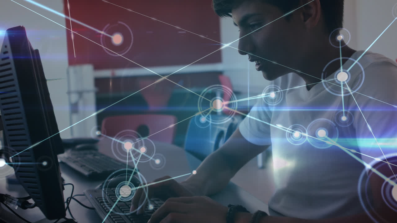 Glowing network of connections against indian boy using computer in the class at school