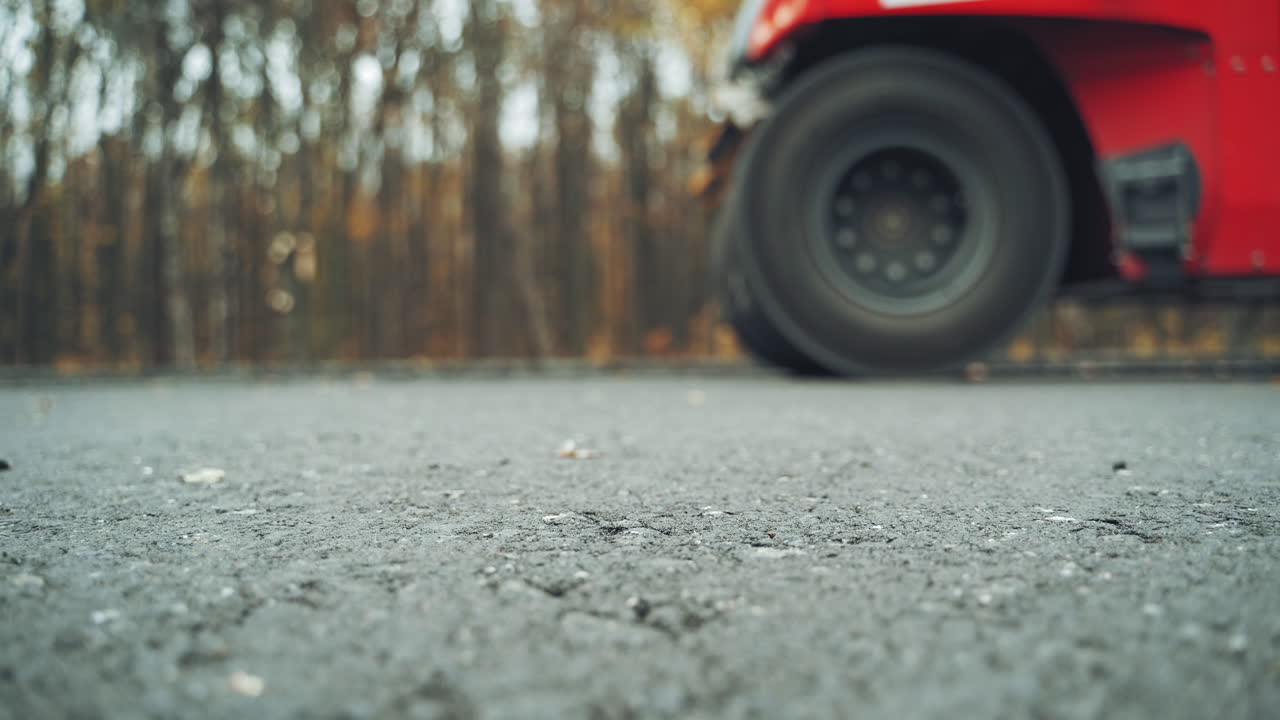 Asphalting of road with steamroller. Road roller and asphalt paving machine at construction site