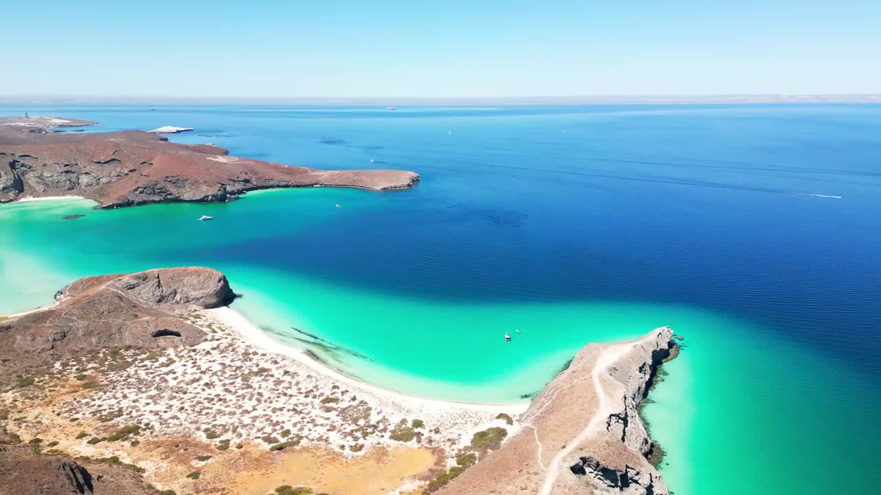 Turquoise waters and desert landscape of La Paz Tecolotito, calm aerial view