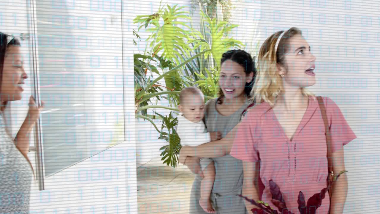 Host peering through peep opening door as visitor holding baby arriving, greeting in home foyer