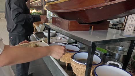 sequential preparation of a noodle soup dish