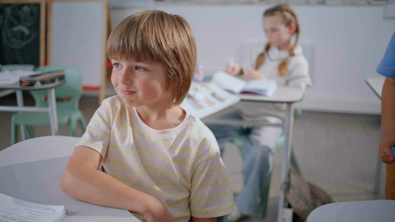 Cute child looking camera at elementary school portrait. Boy relaxing at break