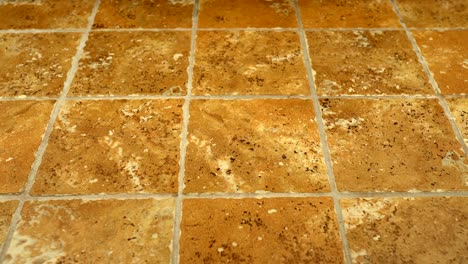 installed ceramic floor tiles - brown and yellowish textures