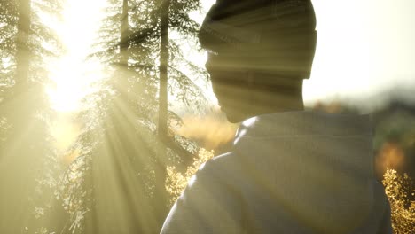 young woman standing alone outdoor with wild forest mountains