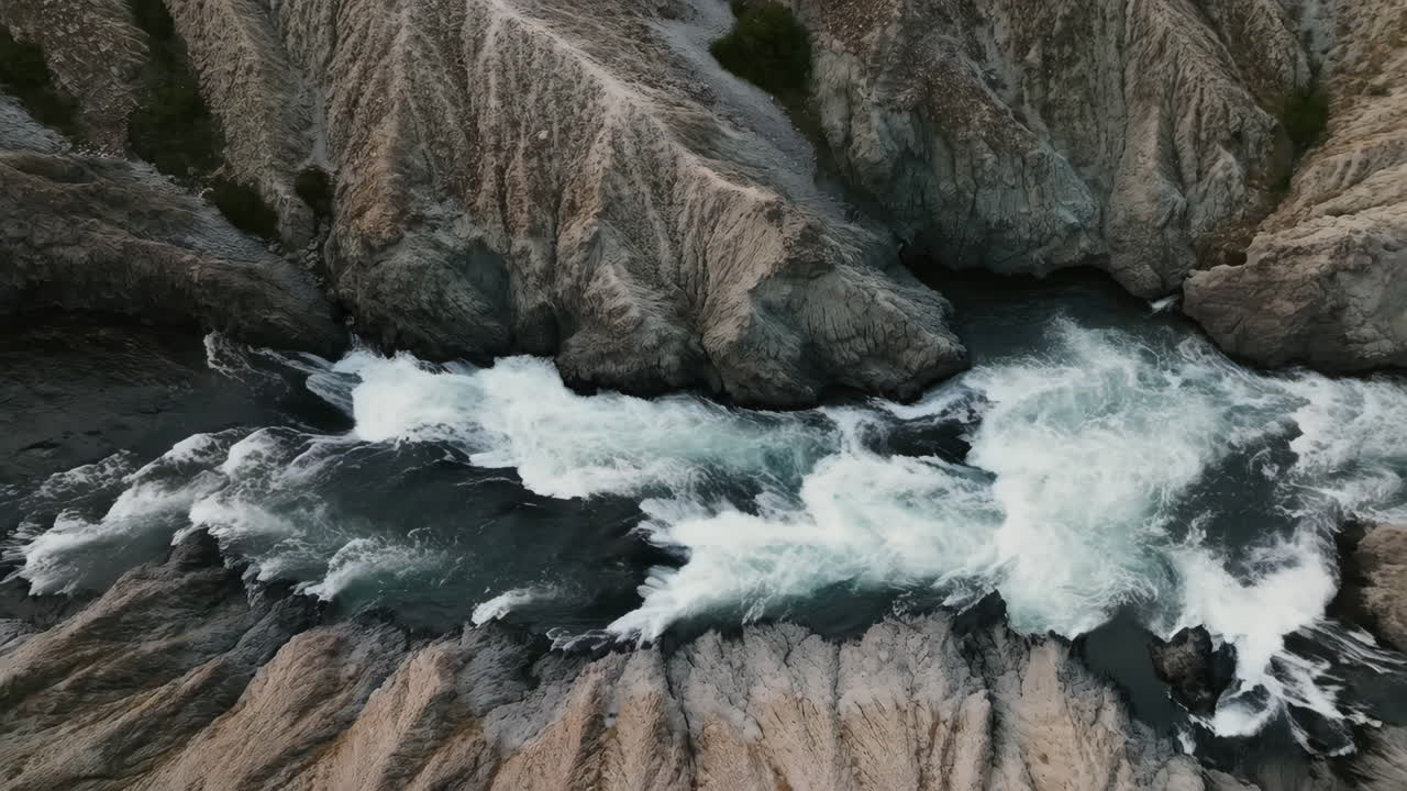 Aerial View of River Rapids in a Rocky Canyon