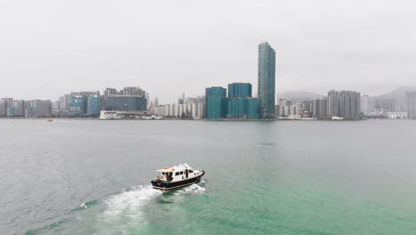 Static-aerial-of-an-Asian-boat-sailing-on-a-canal