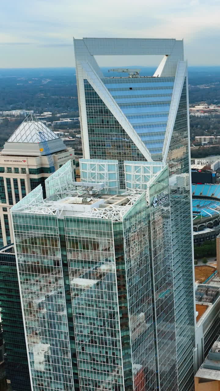 Charlotte, North Carolina, USA - January 05, 2024: Aerial view of downtown district of Charlotte city. Glass and steel high skyscraper buildings in modern american midtown. Vertical video