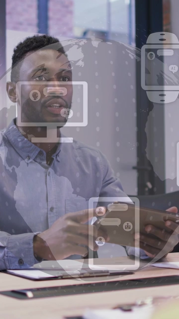 Vertical video: Man leading biz meeting using tablet speaking overlay icons showing reaching shake