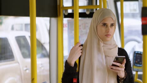 woman in hijab using mobile phone 4k