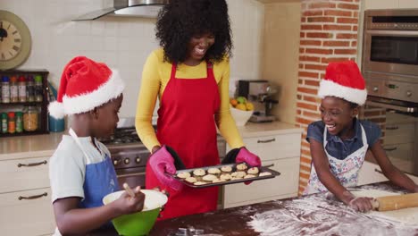 african american mother and her children in the kitchen