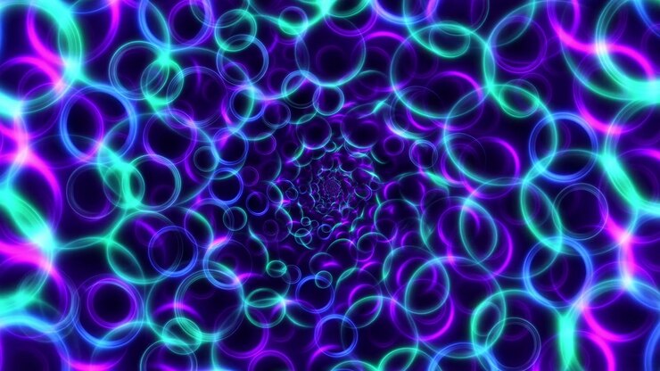 Abstract luminous rings in purple, blue, and cyan form a deep tunnel illusion on a dark background with soft motion and radiant futuristic light