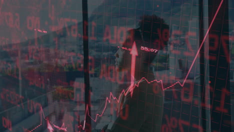 in office, businessman observing fluctuating stock market data and animation graphs