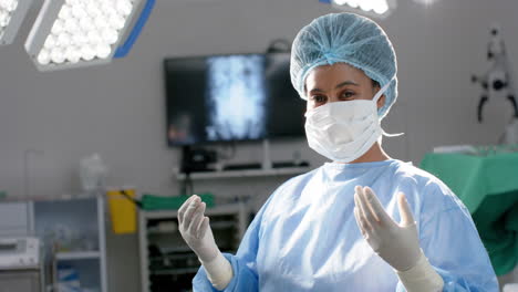 focused surgeon prepares for a procedure in an operating room