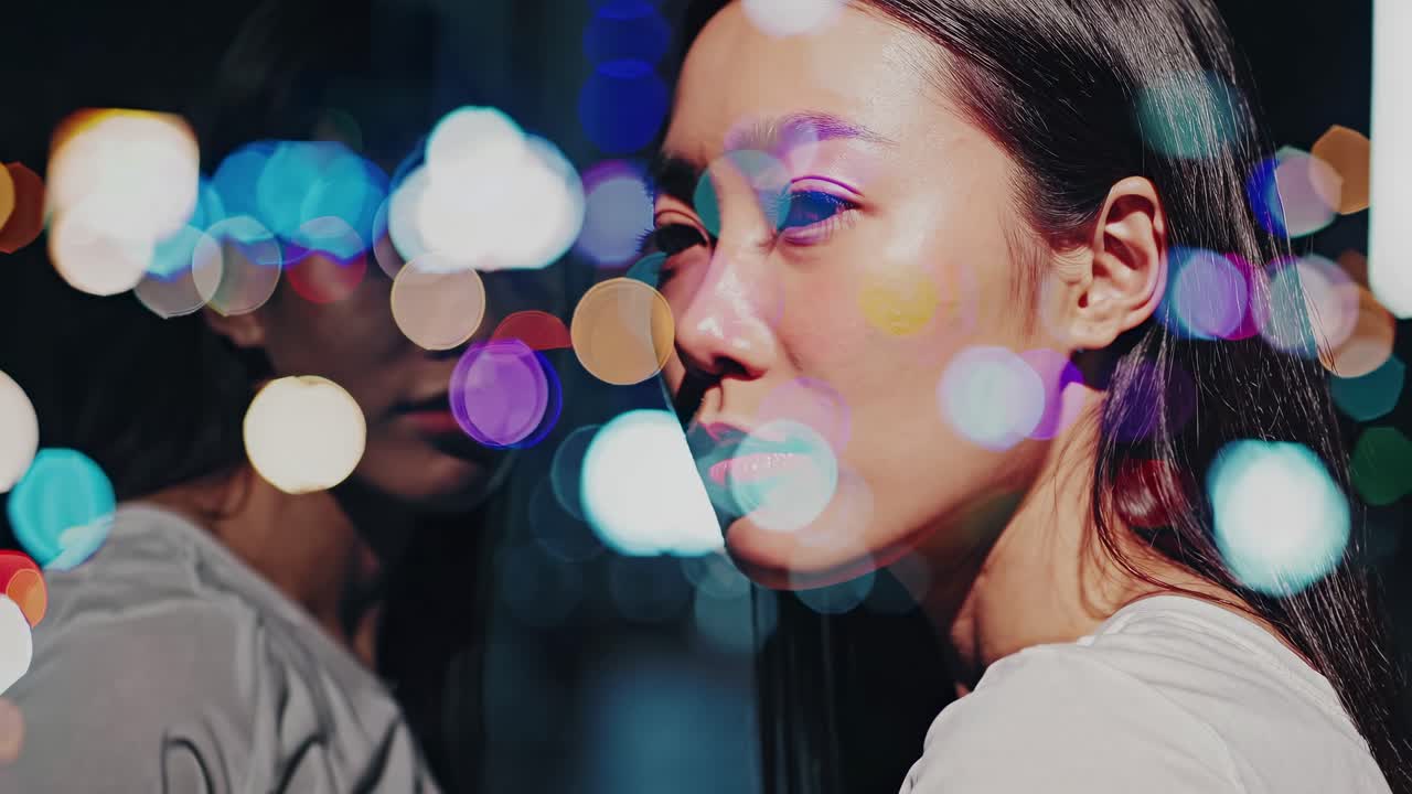 Artistic video concept with a close-up angle, blending a woman's profile with colorful bokeh lights