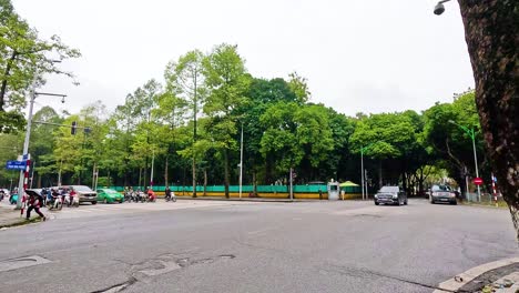 traffic and pedestrians at a bustling street corner