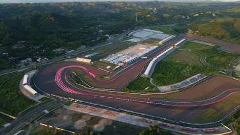 Discover-the-scenic-Mandalika-Circuit-in-the-morning,-surrounded-by-lush-green-landscapes-and-gentle-hills