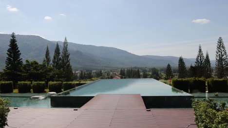 infinity pool overlooking mountains and trees