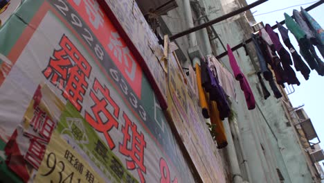 laundry hanging over hong kong street