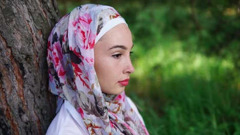 woman in hijab in a forest