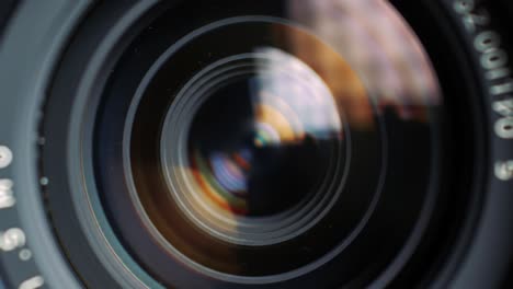 close-up exploration of a camera lens, capturing intricate reflections and light patterns, showcasing the art of photography and the mechanics of focus