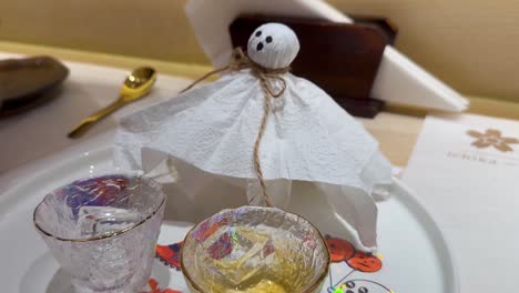 festive drinks with halloween-themed ghost decoration