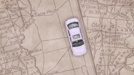 a white car circulates from top to bottom of the scene on a map