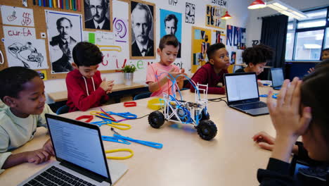 young students engaged in robotics and stem education in a classroom setting
