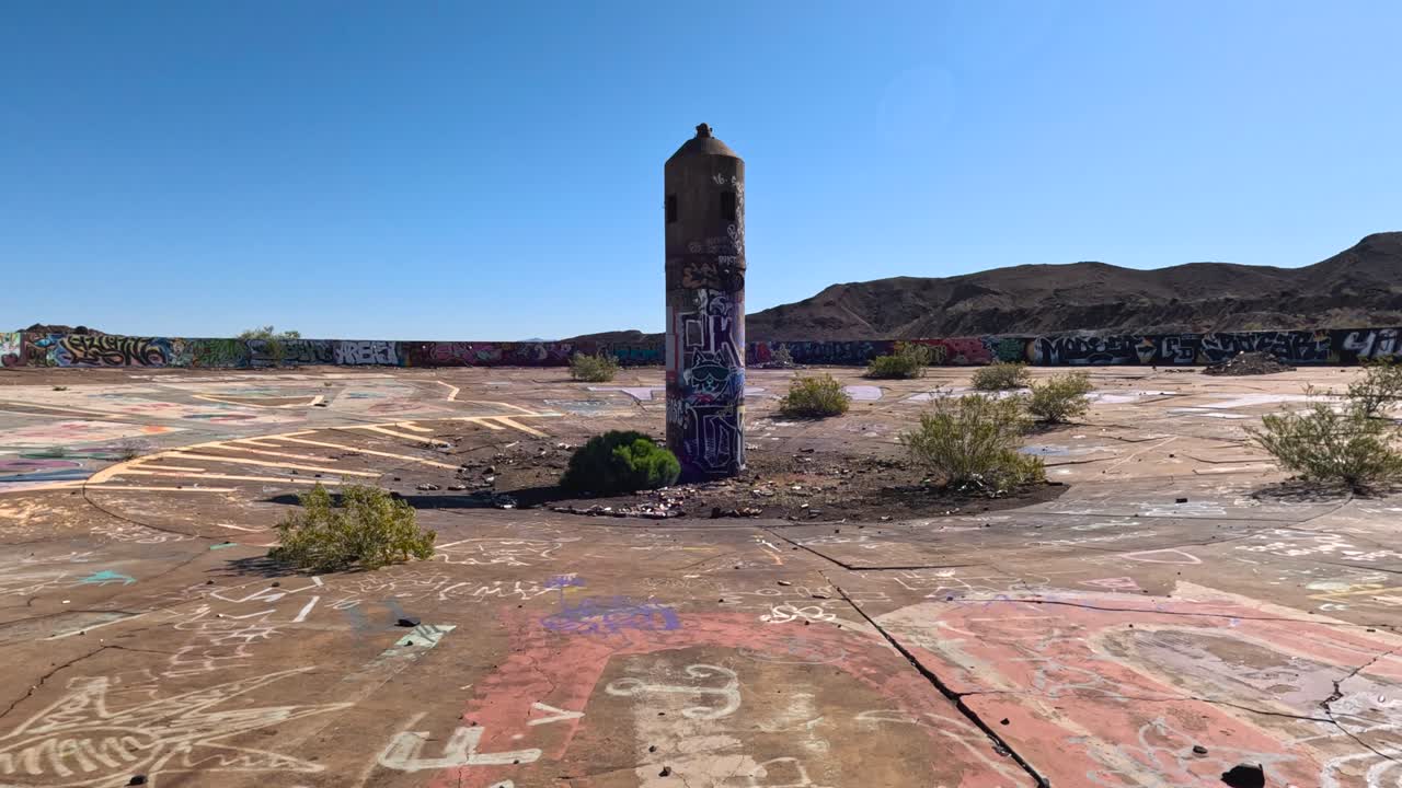 Abandoned Graffiti-Covered Concrete Landscape in a Desert
